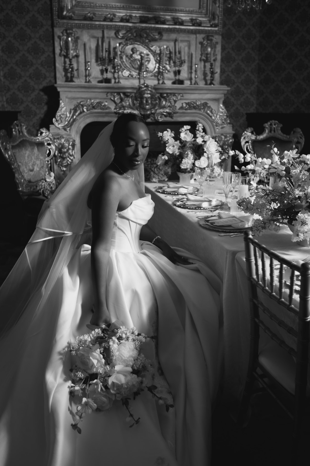 Bride seated beside the head table at Stan Mansion, black and white