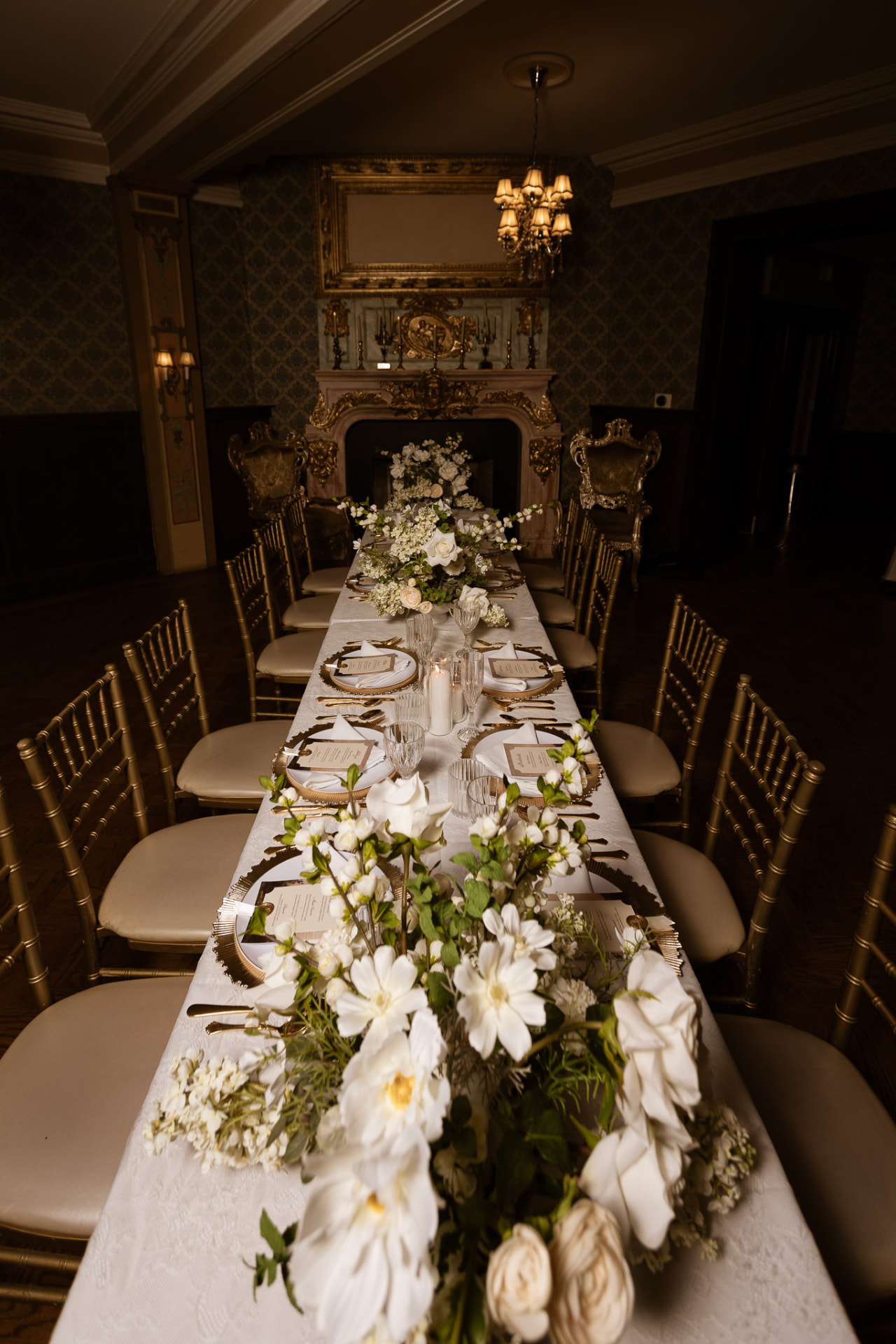 Long tablescape with white florals running down the center