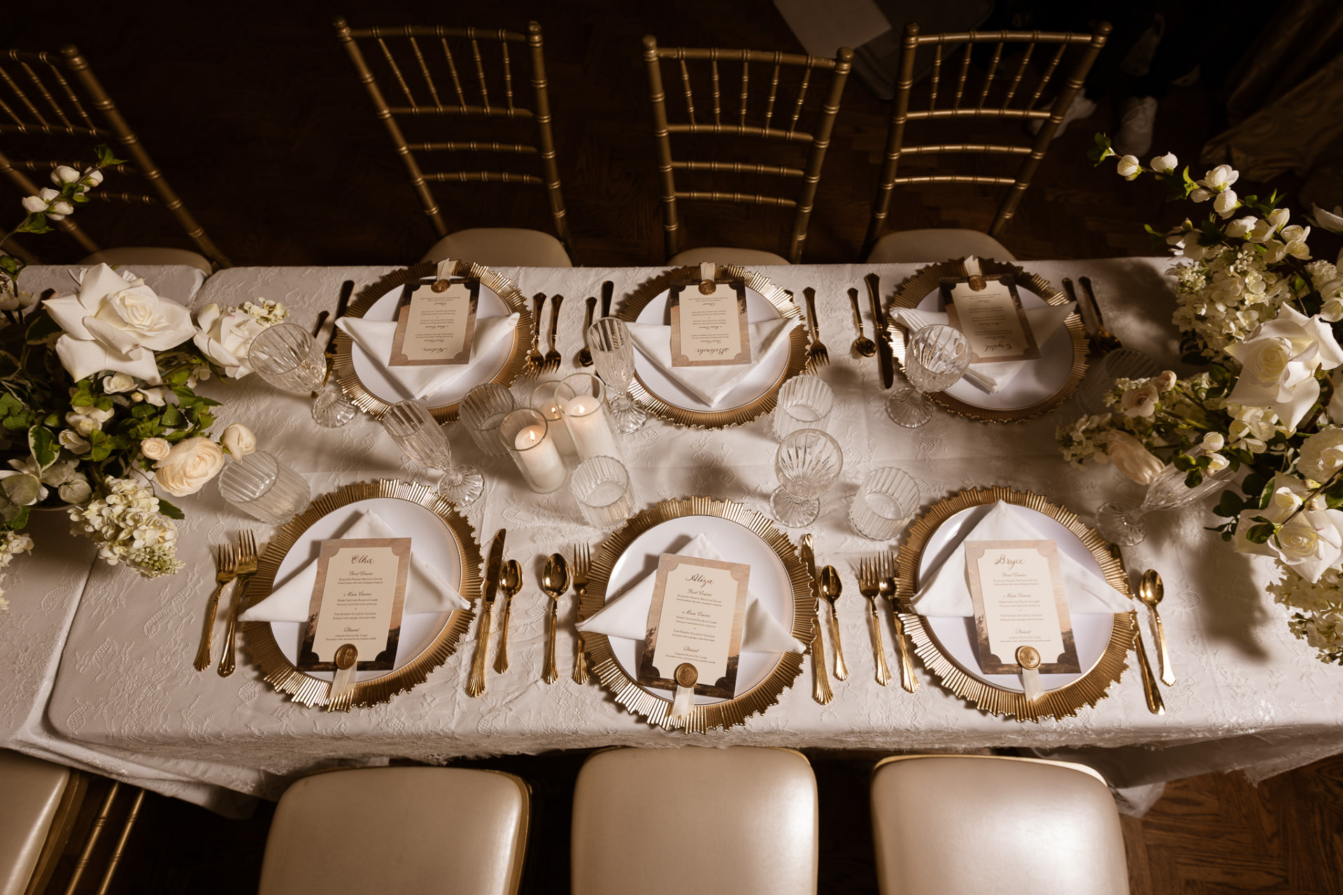 Gold charger place settings with printed menus from above
